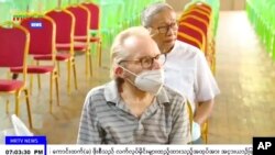 Australian Sean Turnell is shown seated during a ceremony inside the Insein prison in Yangon, Myanmar on Thursday, Nov. 17, 2022. 