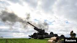 Ukrainian service members fire a shell from a towed howitzer FH-70 at a front line in the Zaporizhzhia Region, Ukraine Oct. 27, 2022.