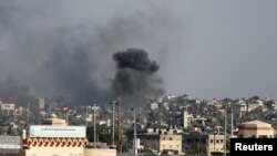 Smoke rises after an Israeli airstrike, amid the ongoing conflict between Israel and Palestinian Islamist group Hamas, in Khan Younis, southern Gaza Strip, December 9, 2023. 