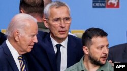 (From L) US President Joe Biden, NATO Secretary-General Jens Stoltenberg and Ukraine's President Volodymyr Zelenskyy talk ahead of a working session on Ukraine during the NATO summit, in Vilnius, July 12, 2023. 