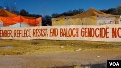 Activists' banner is displayed near the Islamabad press club, Dec. 20, 2023. (Malik Waqar Ahmed/VOA) 