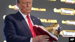 Election 2024 Trump/gold Trump sneakers (AP)