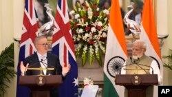 Indian Prime Minister Narendra Modi watches as his Australian counterpart Anthony Albanese makes a press statement, in New Delhi, India, Friday, March 10, 2023.