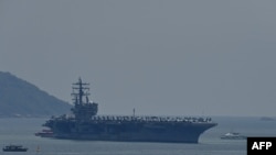 The USS Ronald Reagan, a US Navy Nimitz-class nuclear-powered aircraft carrier, pulls into port in Danang on June 25, 2023. 