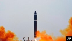 This photo provided by the North Korean government, shows what it says a test launch of a Hwasong-15 intercontinental ballistic missile at Pyongyang International Airport in Pyongyang, North Korea, Feb. 18, 2023.