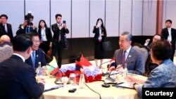 Photo of foreign ministers of China, Laos, Myanmar, Thailand at informal meeting. Credit CCTV VIA AP