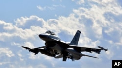 This image provided by the U.S. Air Force shows a F-16 Fighting Falcon from the 510th Fighter Squadron taking off during Red Flag 24-1 at Nellis Air Force Base, Nevada, on Jan 25, 2024. 