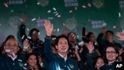 Taiwanese Vice President Lai Ching-te, also known as William Lai, left, celebrates his victory with running mate Bi-khim Hsiao, right, in Taipei, Taiwan, Jan. 13, 2024.