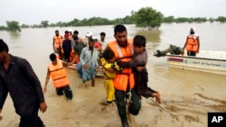 Army troops evacuate people from a flood-hit area in Rajanpur, district of Punjab, Pakistan, Aug. 27, 2022.