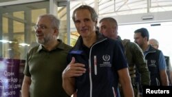 IAEA Director General Rafael Mariano Grossi and Ukrainian Minister of Energy German Galushchenko walk as the International Atomic Energy Agency mission arrives in Zaporizhzhia amid Russia's invasion of Ukraine, in Zaporizhzhia, Ukraine, Aug. 31, 2022.