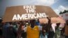 People protest for the release of kidnapped missionaries near the Ohio-based Christian Aid Ministries headquarters in Titanyen, north of Port-au-Prince, Haiti, Oct. 19, 2021.