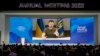 Ukrainian President Volodymyr Zelenskyy displayed on a screen as he addresses the audience from Kyiv on a screen during the World Economic Forum in Davos, Switzerland, May 23, 2022.