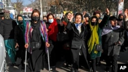 Afghan women chant slogans during a protest against the ban on university education for women, in Kabul, Afghanistan, Dec. 22, 2022.