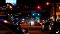 Police investigate a scene where a shooting took place in Monterey Park, Calif., Jan. 22, 2023.