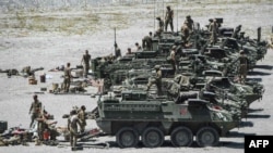 American troops stand by Stryker armoured fighting vehicles after participating in live fire drills as part of the annual U.S.-Philippines joint military exercises at Crow Valley in Capas, Tarlac province, Philippines in this April 10, 2019 file photo. 