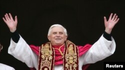 FILE - Pope Benedict XVI, Cardinal Joseph Ratzinger of Germany, waves from a balcony of St. Peter's Basilica, Vatican City, April 19, 2005.