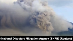 Mount Semeru volcano erupts as seen from Lumajang, East Java province, Indonesia, Dec. 4, 2022. 