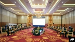 The Association of Southeast Asian Nations, ASEAN, members attend a meeting during the Foreign Ministers Interface Meeting with ASEAN Intergovernmental Commission on Human Rights (AICHR) representatives in Phnom Penh, Cambodia, Tuesday, Aug. 2, 2022. (AP 