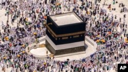 Muslim pilgrims walk around the Kaaba, the cubic building at the Grand Mosque, during the annual hajj pilgrimage, in Mecca, Saudi Arabia, on July 10, 2022.