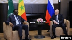 Russia's President Vladimir Putin (right) attends a meeting with Senegal's President Macky Sall, who is currently the chairman of the African Union, at the Bocharov Ruchei state residence in Sochi, Russia, June 3, 2022, in a Sputnik/Mikhail Klimentyev/Kre