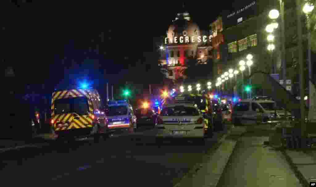 In this video grab taken Thursday July 14, 2016, ambulances and Police cars are seen after a truck drove on to the sidewalk and plowed through a crowd of revelers who’d gathered to watch the fireworks in the French resort city of Nice.