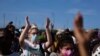 FILE - Anti-government protesters rally against ongoing food shortages and high prices for foodstuff, at the Maximo Gomez monument in Havana, Cuba, July 11, 2021.