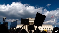 Abortion-rights activists protest outside the Supreme Court in Washington, June 25, 2022.