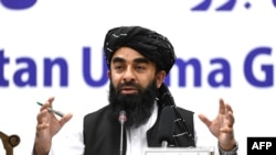 FILE - Taliban spokesman Zabihullah Mujahid speaks during a press conference in Kabul on June 30, 2022.