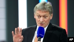 FILE - Kremlin spokesman Dmitry Peskov speaks to journalists in Moscow, Russia, on Dec. 23, 2021.