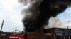 Firefighters work to control flames at the central market of Sloviansk on July 5, 2022, following a suspected missile attack. 