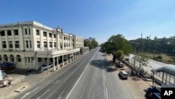 A stretch of the popular Strand Road sits empty in Yangon, Myanmar on Tuesday, Feb. 1, 2022. Opponents of military rule in Myanmar on Tuesday marked the one-year anniversary of the army's seizure of power with a nationwide strike to show their strength and solidarity amid concern