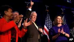 House Minority Leader Nancy Pelosi of Calif., right, steps away from the podium as House Minority Whip Steny Hoyer, D-Md., makes the thumbs up sign, after Pelosi spoke about Democratic gains in the House of Representatives to a crowd of Democratic support