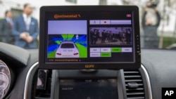 A display inside a Tesla Model 90D during a demonstration of self-driving car technology on Capitol Hill in Washington, March 15, 2016. 