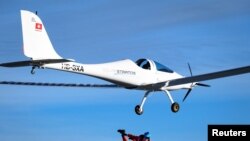 Swiss adventurer Raphael Domjan jumps from the SolarStratos solar-powered aircraft prototype with Spanish test pilot Miguel Iturmendi aboard, at the airbase in Payerne, Switzerland, Aug. 25, 2020. 