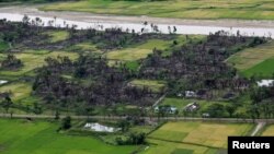 အကြမ်းဖက်တိုက်ခိုက်မှုတွေအတွင်း နေအိမ်များ မီးရှို့ဖျက်ဆီးခံရတဲ့ မောင်တောက ကျေးရွာများ။ 