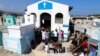 People gather at Our Lady of Sorrows church inside a cemetery during Day of the Dead celebrations, in Port-au-Prince, Haiti November 1, 2021. REUTERS/Ralph Tedy Erol