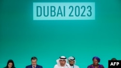 TOPSHOT - COP28 president Sultan Ahmed Al Jaber (C) presides the opening ceremony of the COP28 United Nations climate summit in Dubai on November 30, 2023.