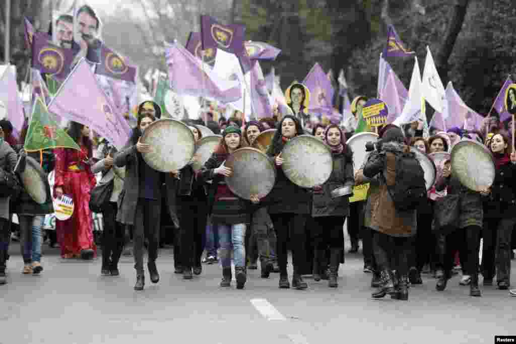 Women walk as they shout slogans during an International Women&#39;s Day rally in Istanbul, Turkey, March 8, 2015.