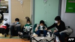 Children receive a drip at a children hospital in Beijing on November 23, 2023.