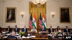 India's Prime Minister Narendra Modi (C L) and , US President Joe Biden (C R) meet with (L-R) Chairman & Managing Director of Reliance Industries Mukesh Ambani, Google CEO Sundar Pichai, Apple CEO Tim Cook, Microsoft CEO Satya Nadella, 3rdiTech Co-Founde