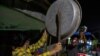 People clatter pans and tins to make noise to protest the military coup in response to a social media campaign in Yangon on February 2, 2021, as the party of Myanmar's toppled leader Aung San Suu Kyi demanded her immediate release Tuesday. (Photo by STR /