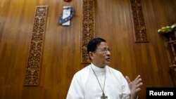 Cardinal Charles Maung Bo gestures during a Reuters interview in his office at Yangon January 6, 2015. Religious extremism could derail Myanmar's much-vaunted reform process, the Buddhist-majority country's first Catholic cardinal, Charles Maung Bo, said 