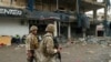 Lebanese army soldiers secure the area outside a building that was targeted in an Israeli airstrike in Beirut's southern suburbs on November 2, 2024, amid the ongoing war between Israel and Hezbollah. Lebanon's health ministry said 11 people were wounded on November 2 in an Israeli strike on Hezbollah's south Beirut stronghold, which has been hard hit by the Israel-Hezbollah war. 