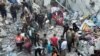 Palestinians search for casualties at the site of Israeli strikes on houses in Jabalia refugee camp at the Indonesian hospital, in the northern Gaza Strip