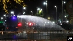 Police use water cannons to disperse protesters Saturday, March 20, 2021 in Bangkok, Thailand. Thailand's student-led pro-democracy movement is holding a rally in the Thai capital, seeking to press demands that include freedom for their leaders, who…