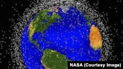 NASA tracks more than 500,000 pieces of space debris as they orbit the Earth, each represented here by a dot.