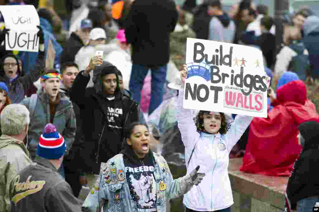 Demonstrators march along the Presidential Inaugural parade route on Pennsylvania Avenue.