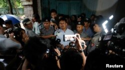 Detained Reuters journalist Wa Lone speaks to the media at a court in Yangon, Myanmar June 18, 2018. REUTERS/Ann Wang - RC15B26650E0