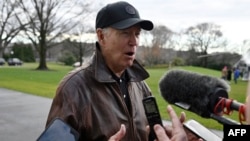 US President Joe Biden speaks to the press as he departs from the South Lawn of the White House in Washington, DC, January 13, 2024.