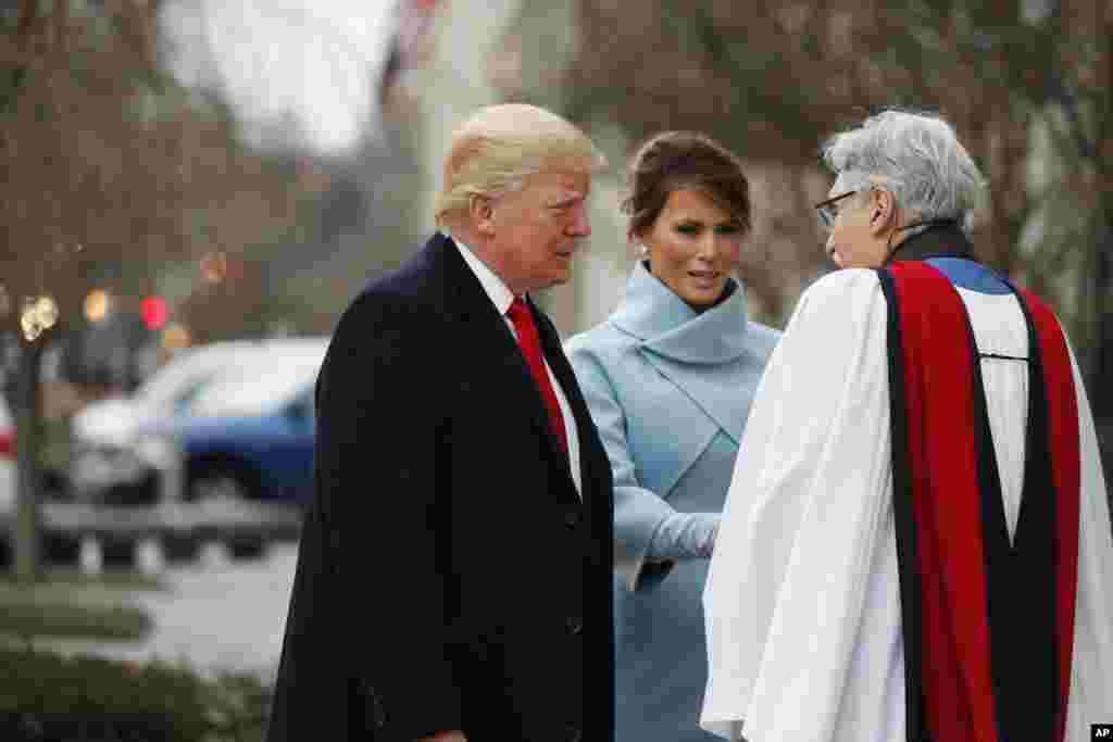 Rev. Luis Leon greets President-elect Donald Trump and his wife Melania as they arrive for a church service at St. John’s Episcopal Church across from the White House in Washington, Jan. 20, 2017, on Donald Trump's inauguration day.